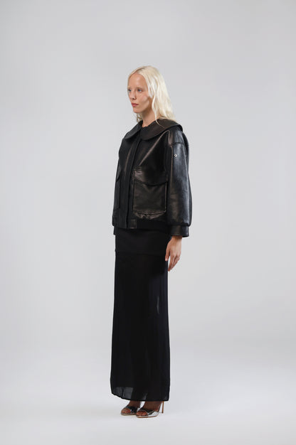 Jinnoir black faux leather jacket, side view on model