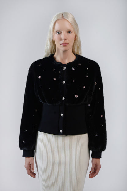 Pearle faux fur cardigan jacket, front view on model, showing the button front and cinched knit waistband