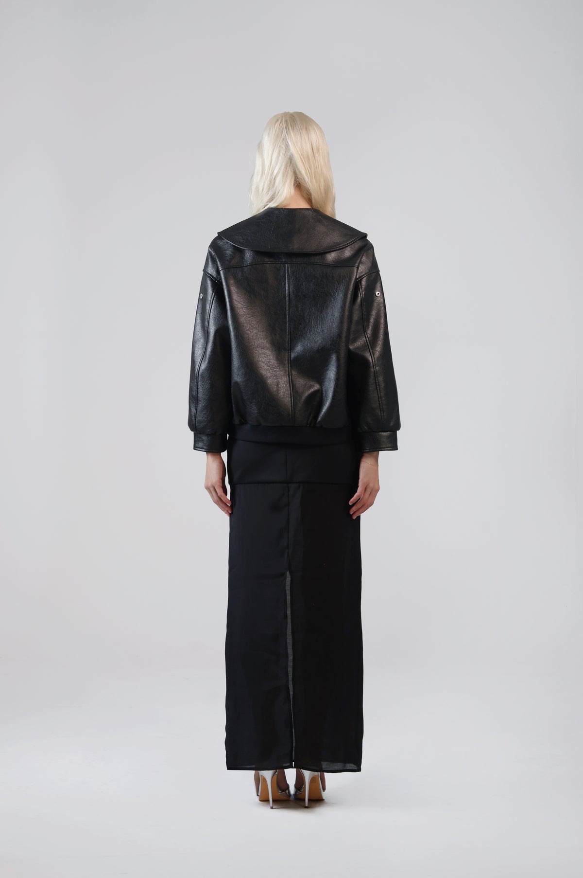 Jinnoir black faux leather jacket, back view on model