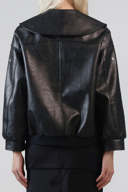 Close-up of the back of the Jinnoir jacket, showing the Peter Pan collar and ribbed hem