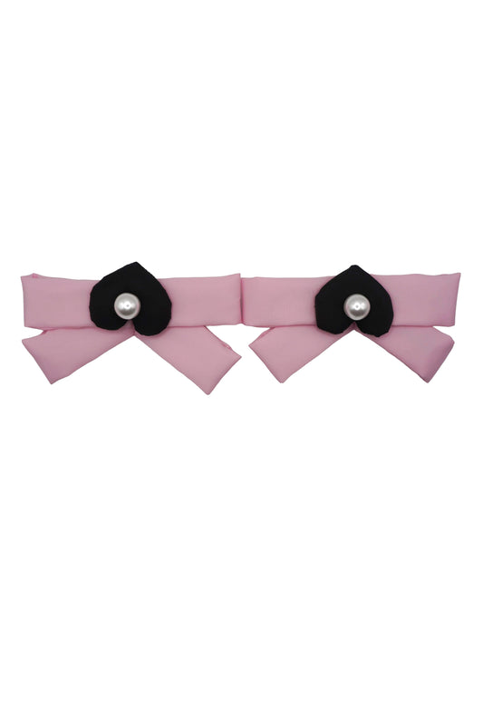 Pair of ballet pink bow charms, each centered with a black mamu heart logo and a pearlescent bead