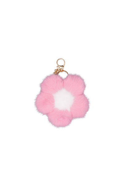 Single bubblegum pink faux fur flower charm on a metal keychain, worn as a bag charm