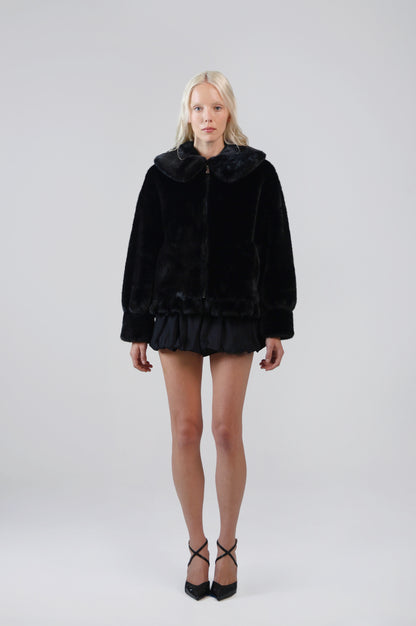 Jinnette black faux fur jacket with an oversized Peter Pan collar and front zip, front view on model