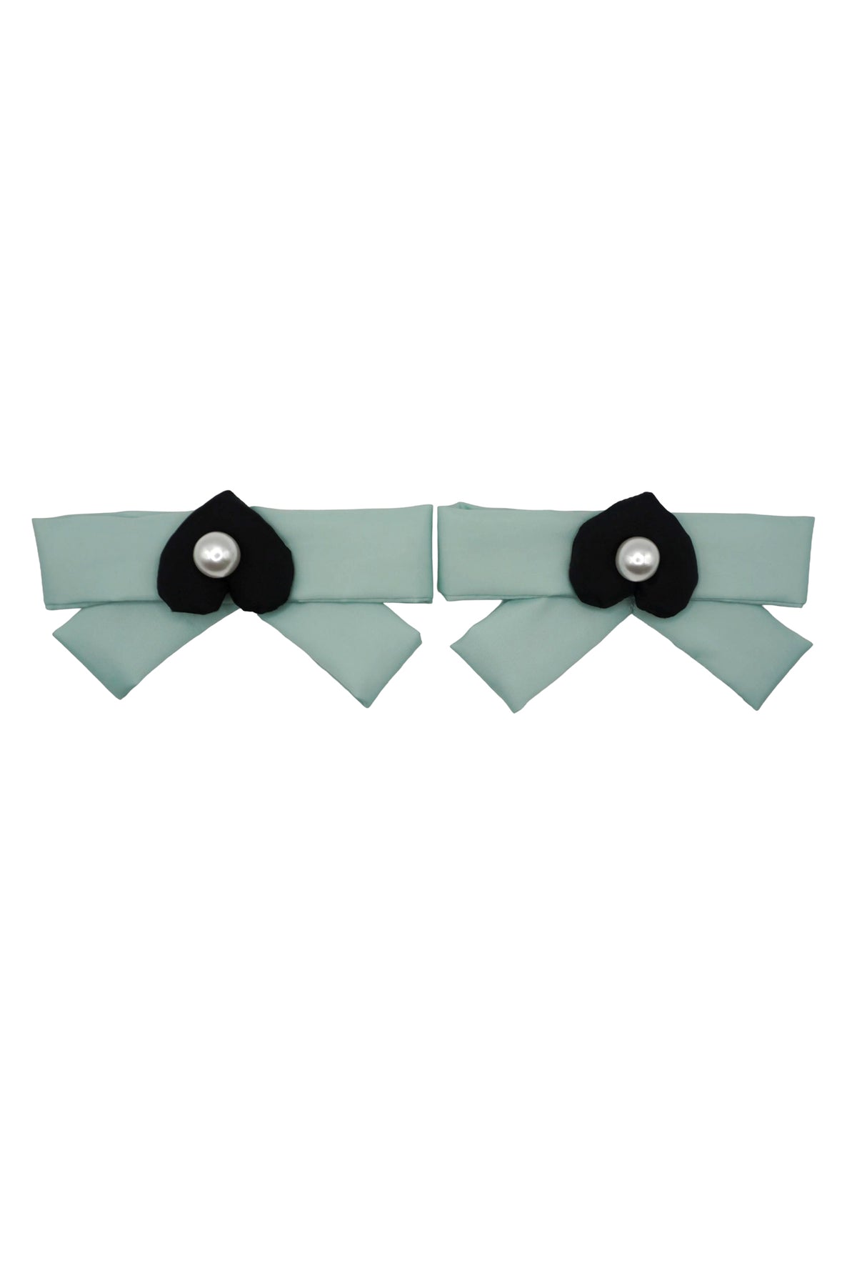 Pair of mint green bow charms, each centered with a black mamu heart logo and a pearlescent bead